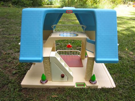 Goes inside the Little Tikes doll house. . Little tykes doll house